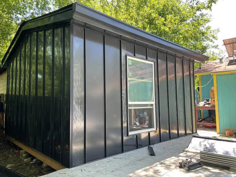 Black standing seam metal wall panels for Metal Roof Installation in Whitefish