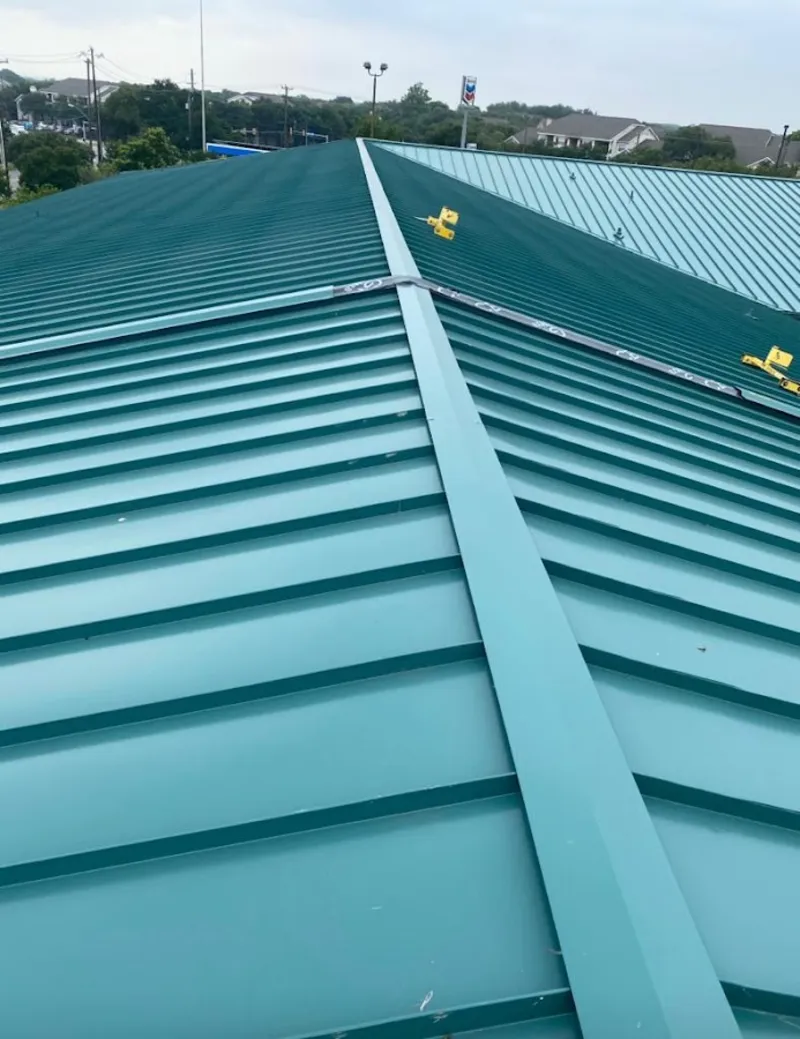 Green commercial metal roof ridge and valley for Metal Roof Repair in Whitefish